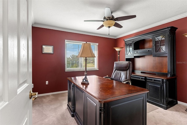 carpeted home office featuring ornamental molding, ceiling fan, and a textured ceiling