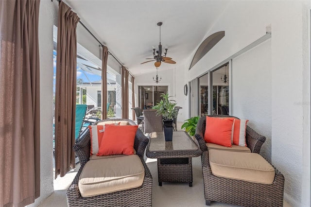 sunroom featuring vaulted ceiling and ceiling fan