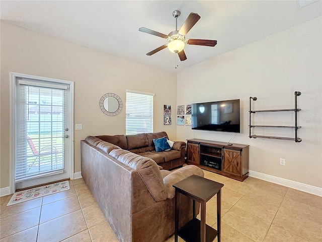 tiled living room with ceiling fan