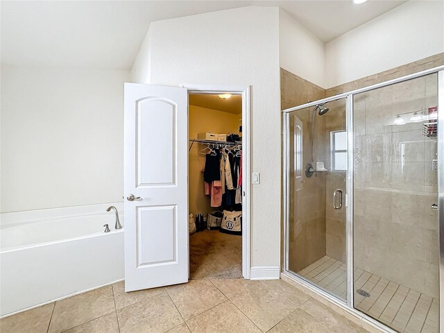 bathroom with tile patterned floors and walk in shower