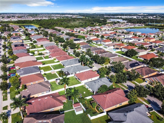 bird's eye view with a water view