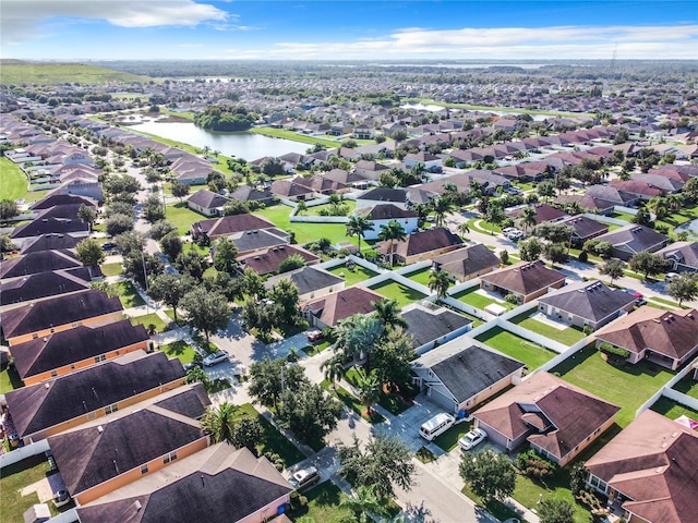 bird's eye view with a water view