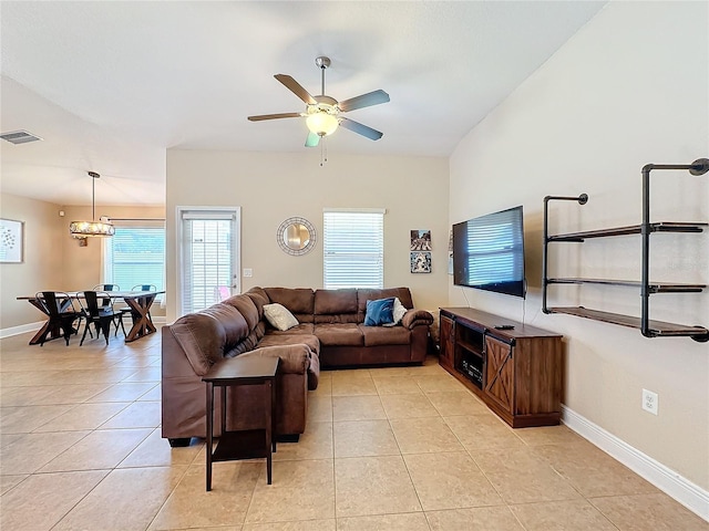 tiled living room featuring ceiling fan