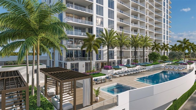 view of swimming pool featuring a patio and a hot tub