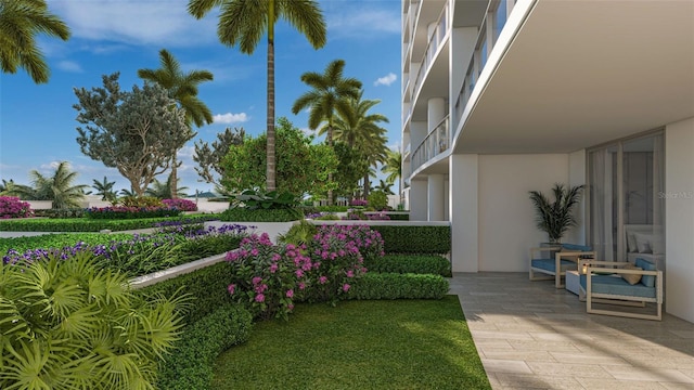 view of yard with a balcony