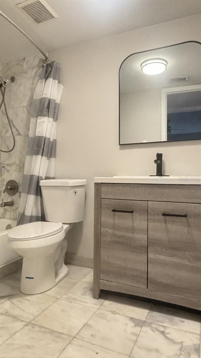 full bathroom with shower / tub combo, tile patterned flooring, vanity, and toilet