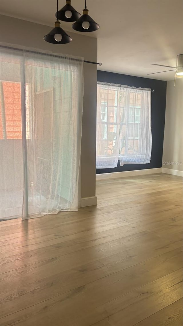 empty room with light hardwood / wood-style flooring