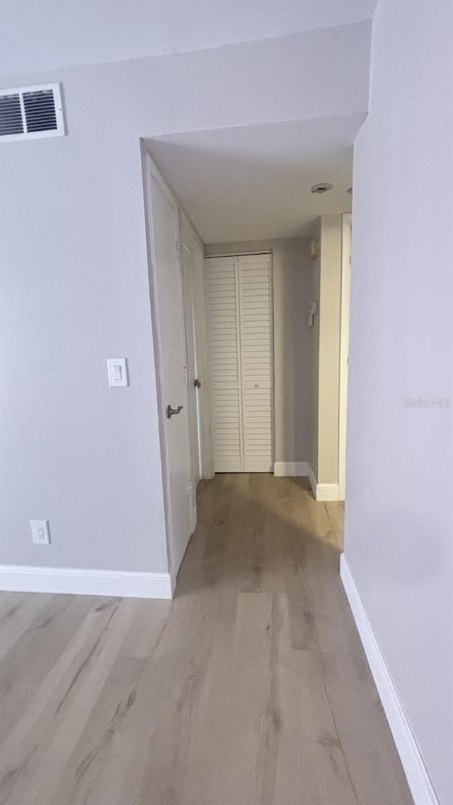 hall with light hardwood / wood-style flooring