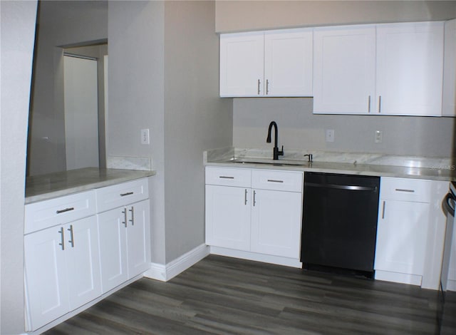 kitchen featuring dishwasher, sink, white cabinets, and dark hardwood / wood-style flooring