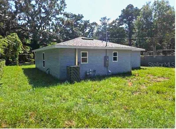 view of home's exterior with a lawn