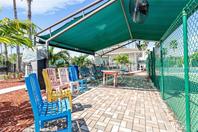 view of property's community with a patio area