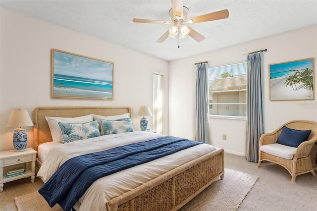 2222 Greenhaven Dr, Sun City Center, FL 33573 - bedroom featuring carpet, ceiling fan, baseboards, and a textured ceiling