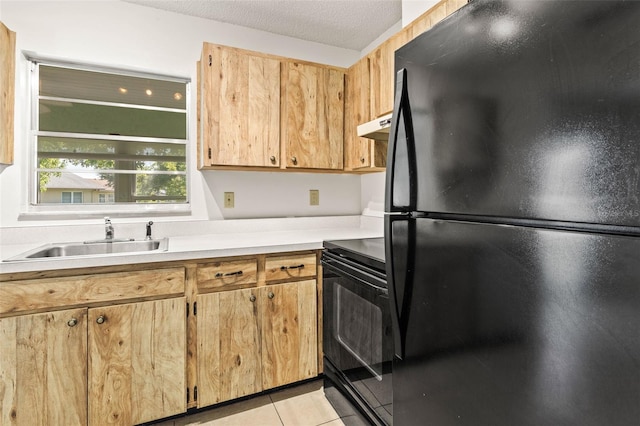 2222 Greenhaven Dr, Sun City Center, FL 33573 - kitchen featuring black appliances, a sink, under cabinet range hood, light tile patterned floors, and light countertops
