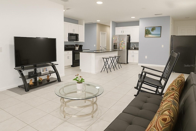 11883 Brighton Knoll Loop, Riverview, FL 33579 - living room with baseboards, recessed lighting, and light tile patterned flooring