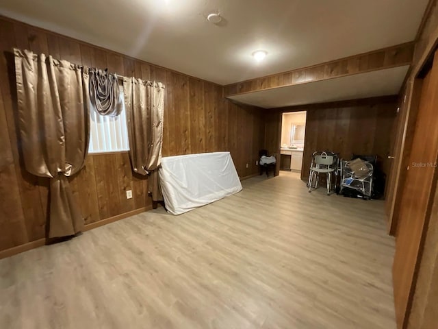 interior space with wooden walls and hardwood / wood-style floors