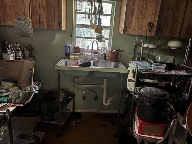 kitchen with brown cabinets and a sink