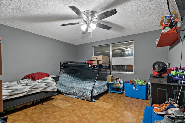 bedroom with parquet flooring, a textured ceiling, and ceiling fan