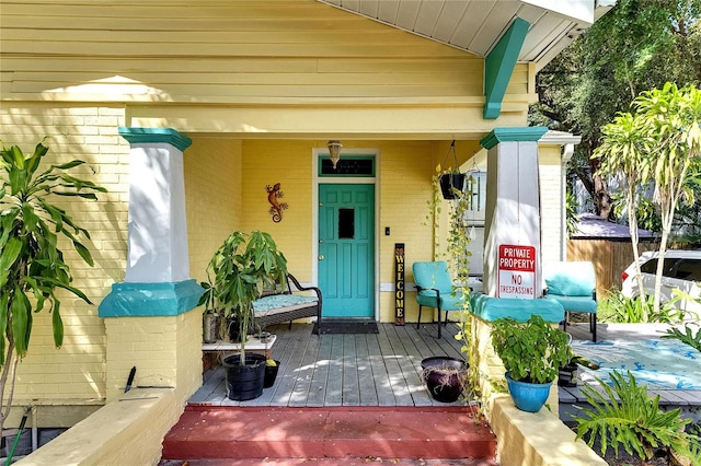 doorway to property featuring covered porch