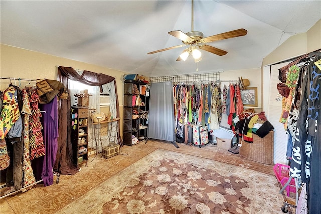 walk in closet featuring ceiling fan and lofted ceiling