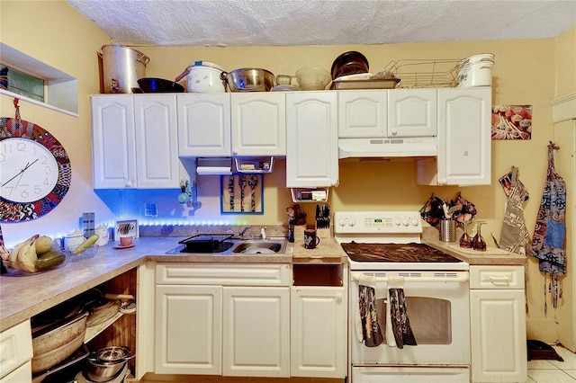 kitchen with white cabinetry, sink, a textured ceiling, and white electric stove