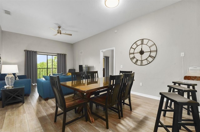 dining area featuring ceiling fan and hardwood / wood-style floors