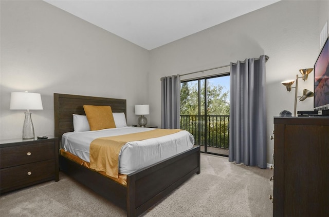 bedroom featuring light colored carpet and access to exterior