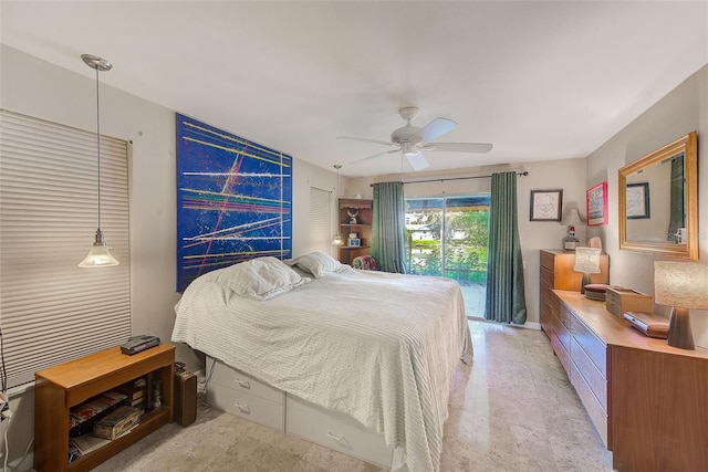 bedroom with access to outside and ceiling fan