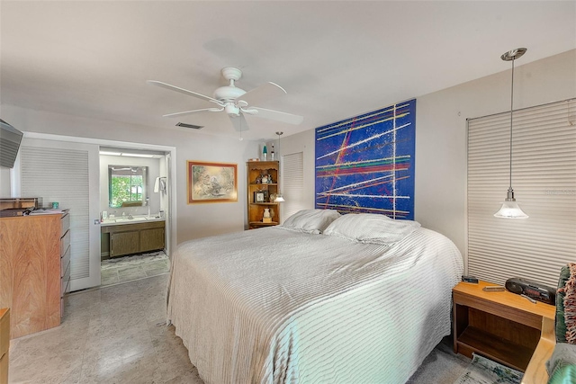 bedroom featuring ensuite bathroom and ceiling fan