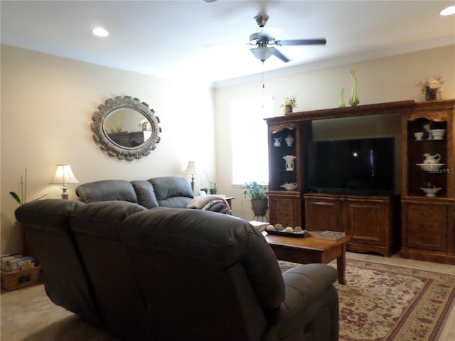 living room featuring ceiling fan and ornamental molding