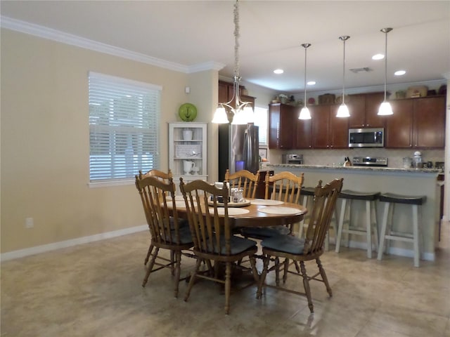 dining area featuring ornamental molding and a notable chandelier