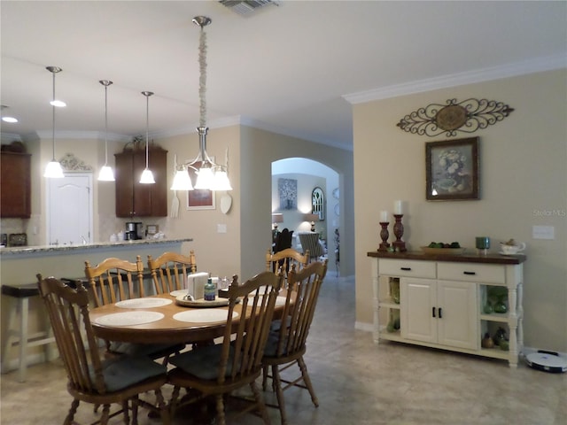 dining area featuring crown molding