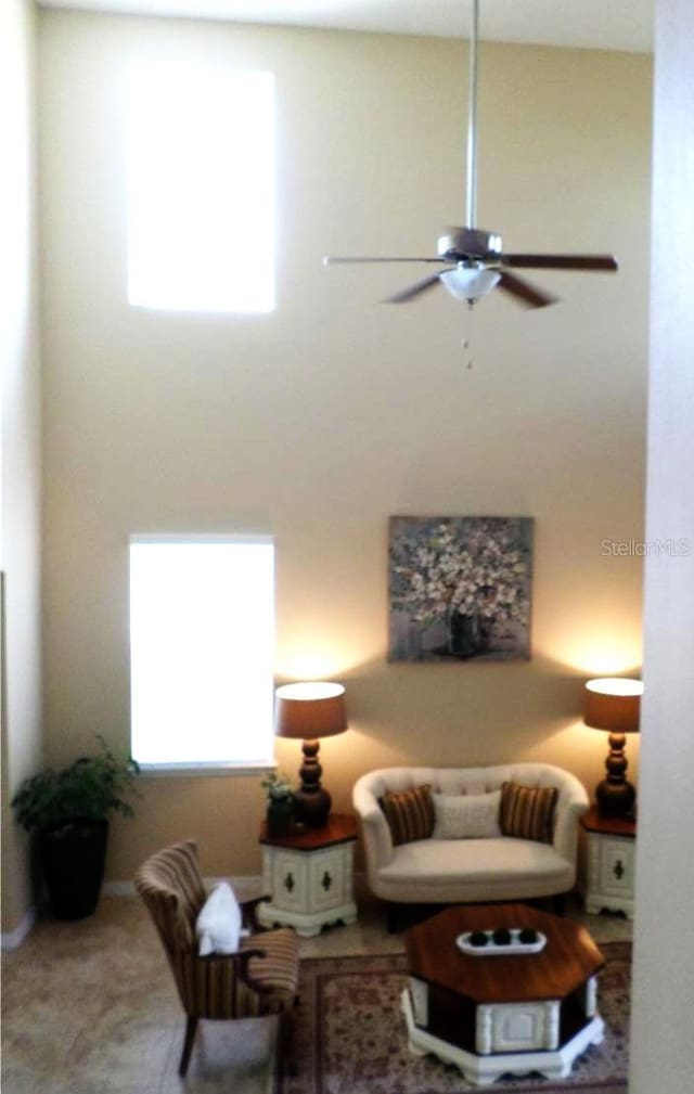 living room with plenty of natural light and ceiling fan