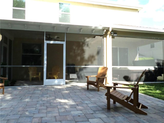 view of patio / terrace featuring a sunroom