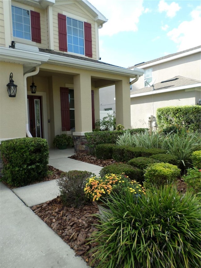 doorway to property with a porch