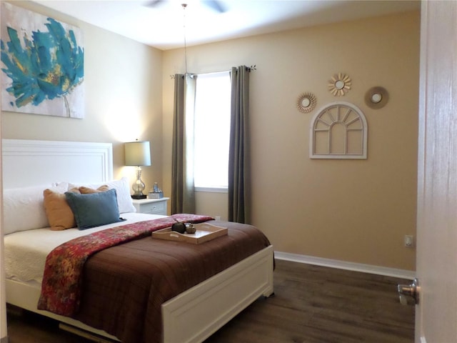 bedroom featuring dark hardwood / wood-style flooring and ceiling fan