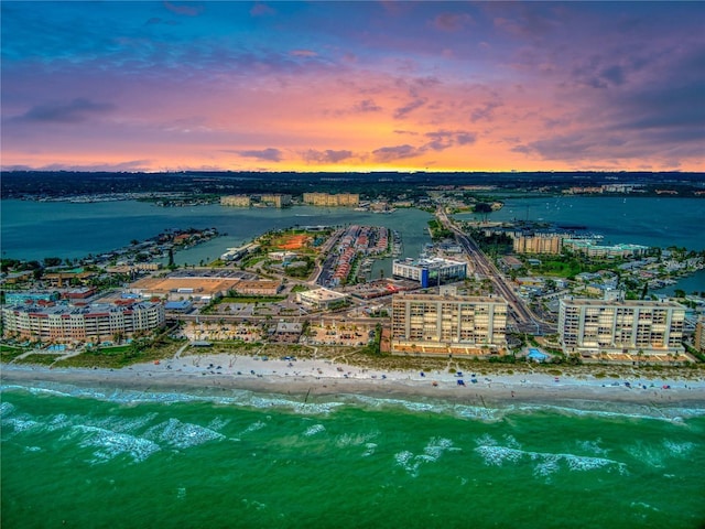 aerial view at dusk with a water view