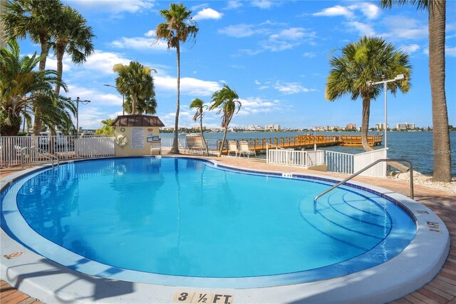 view of swimming pool with a water view