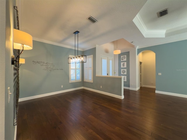 unfurnished room featuring crown molding, dark hardwood / wood-style flooring, and a textured ceiling