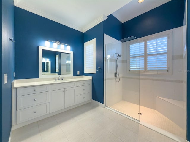 bathroom featuring plenty of natural light, a tile shower, and ornamental molding