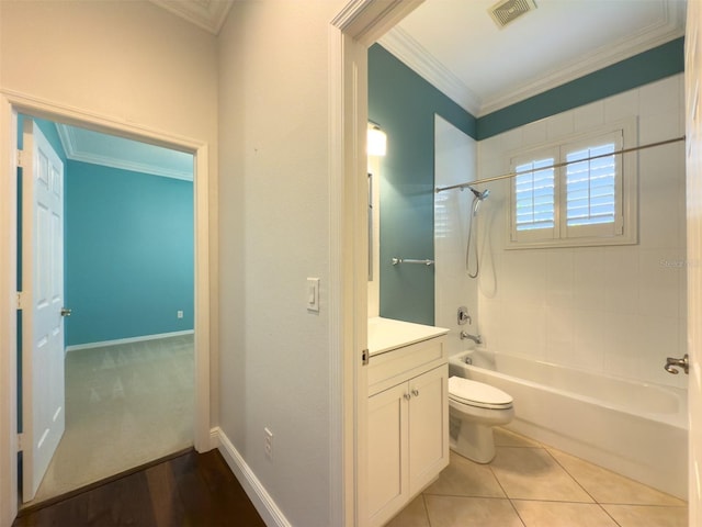 full bathroom featuring tile patterned floors, tiled shower / bath combo, toilet, and ornamental molding