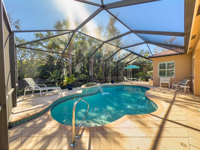 view of pool featuring a lanai and a patio area