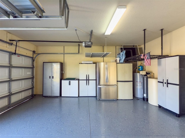 garage featuring a garage door opener, stainless steel refrigerator, and water heater