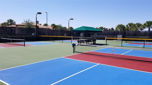 view of sport court with basketball hoop