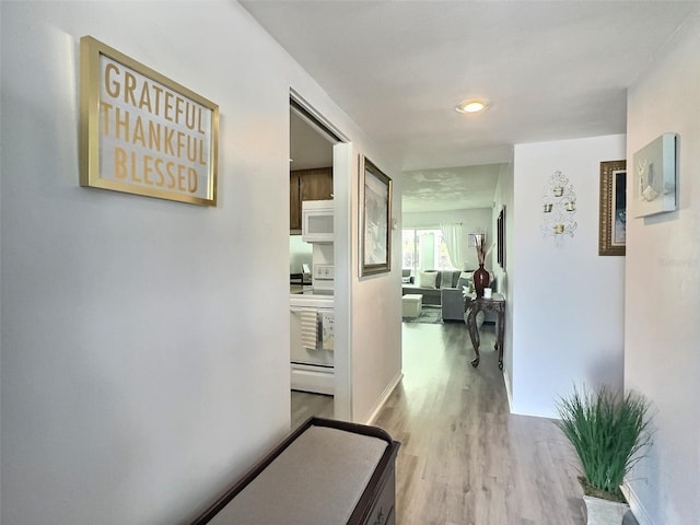 hallway featuring light hardwood / wood-style flooring