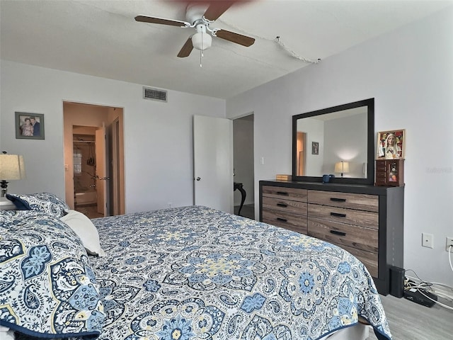 bedroom with ceiling fan and connected bathroom