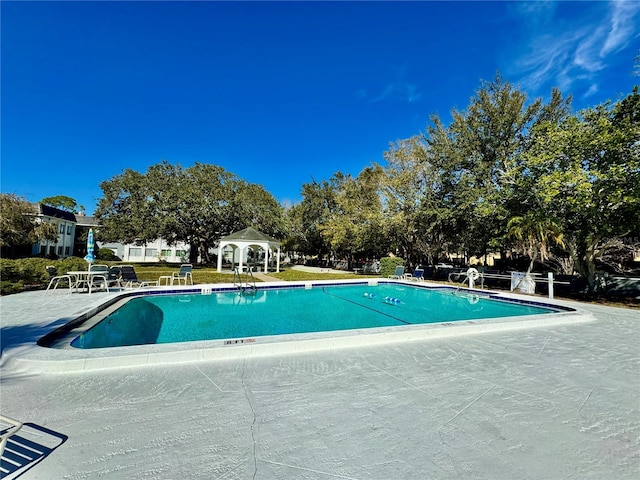 view of swimming pool with a patio