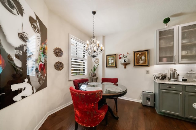 dining room featuring a chandelier and dark hardwood / wood-style flooring