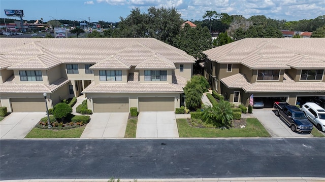 2539 Silverback Ct, Palm Harbor, FL 34684 - view of front facade featuring stucco siding, a tile roof, and driveway