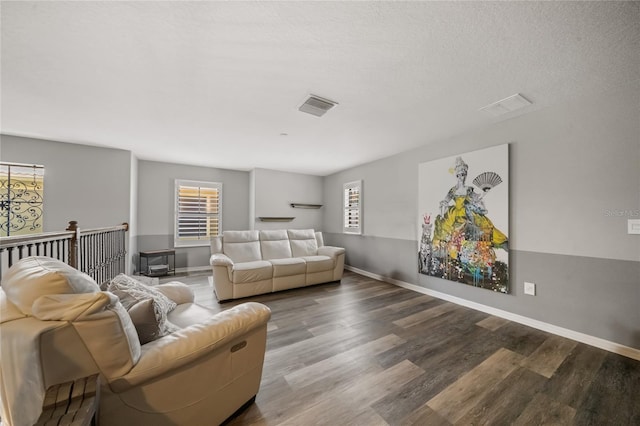 2539 Silverback Ct, Palm Harbor, FL 34684 - living area with baseboards, visible vents, and wood finished floors