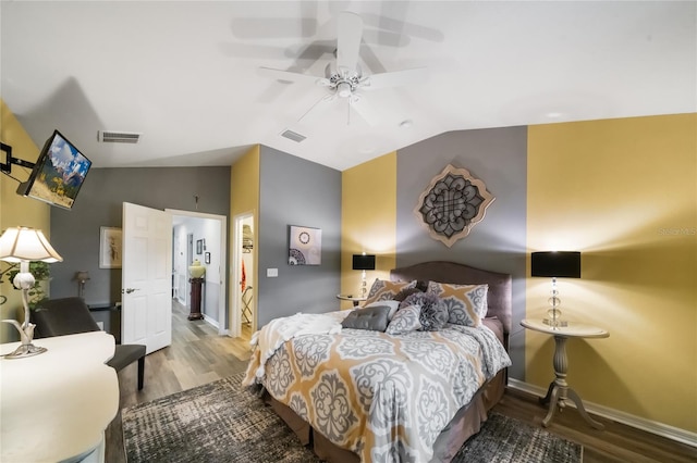 2539 Silverback Ct, Palm Harbor, FL 34684 - bedroom with baseboards, visible vents, vaulted ceiling, and wood finished floors
